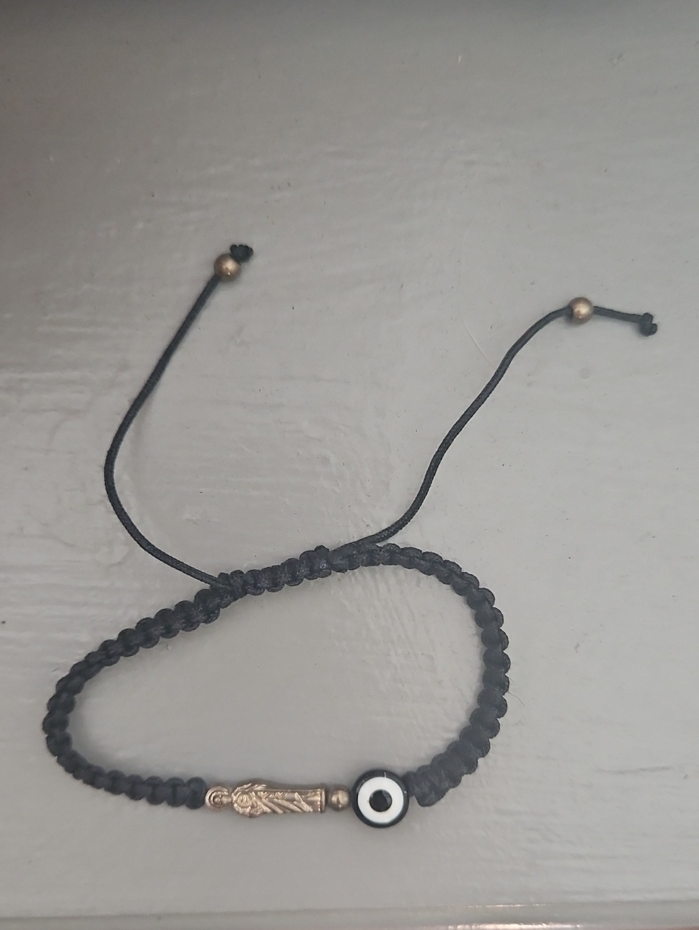 Black Braided Cord Bracelet with Gold Beads and Evil Eye Accent